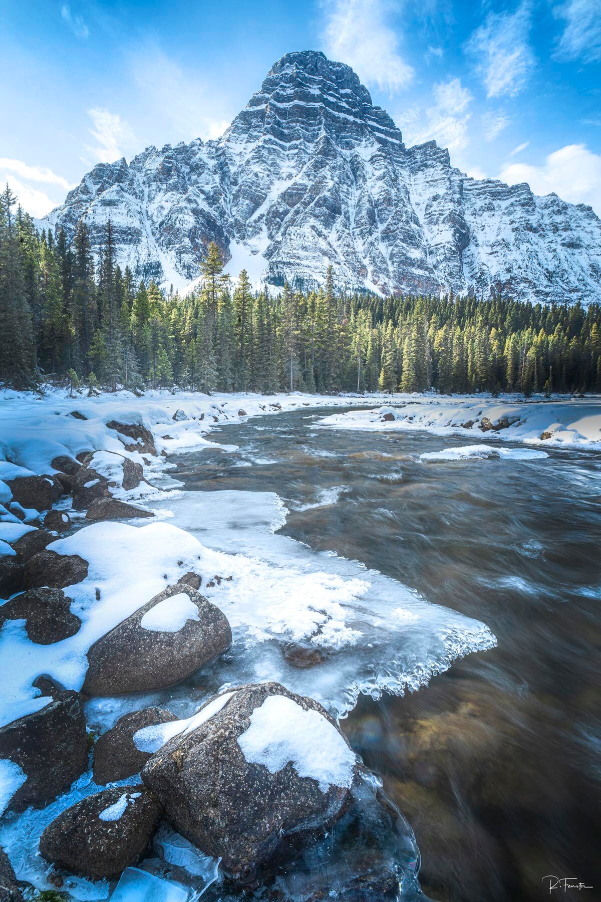 Ice Breaker Ice and snow lay alongside the Mistaya river while Mount Chephren glows in the mid morning sunriseFine Art Limited Edition of...